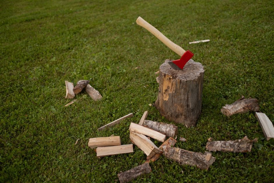 Split Log Rounds into Firewood with an Axe